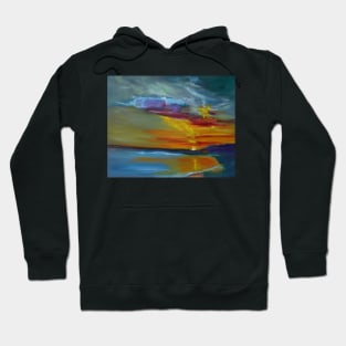 Wild Sunset. The brilliant sun sinks behind the mountain and shines reflections across the ocean and beach in all of its colorful glory. Hoodie